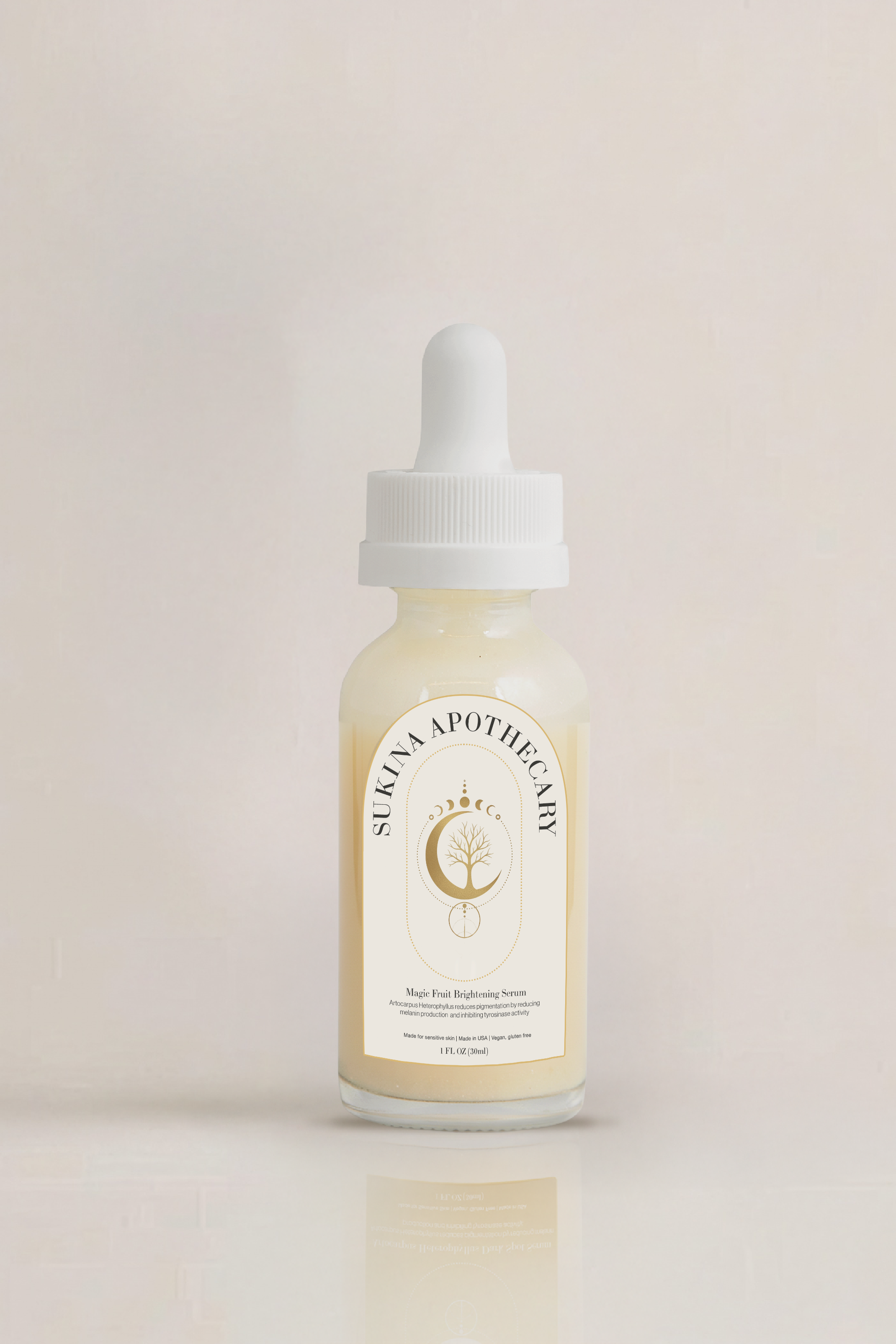 Sukina Apothecary's Magic Fruit Brightening Serum in white dropper bottle with golden label — formulated with Rice Extract, Lentinus Edodes, Tea Tree, and Calendula to reduce dark spots, purify, and enhance skin brightness.
