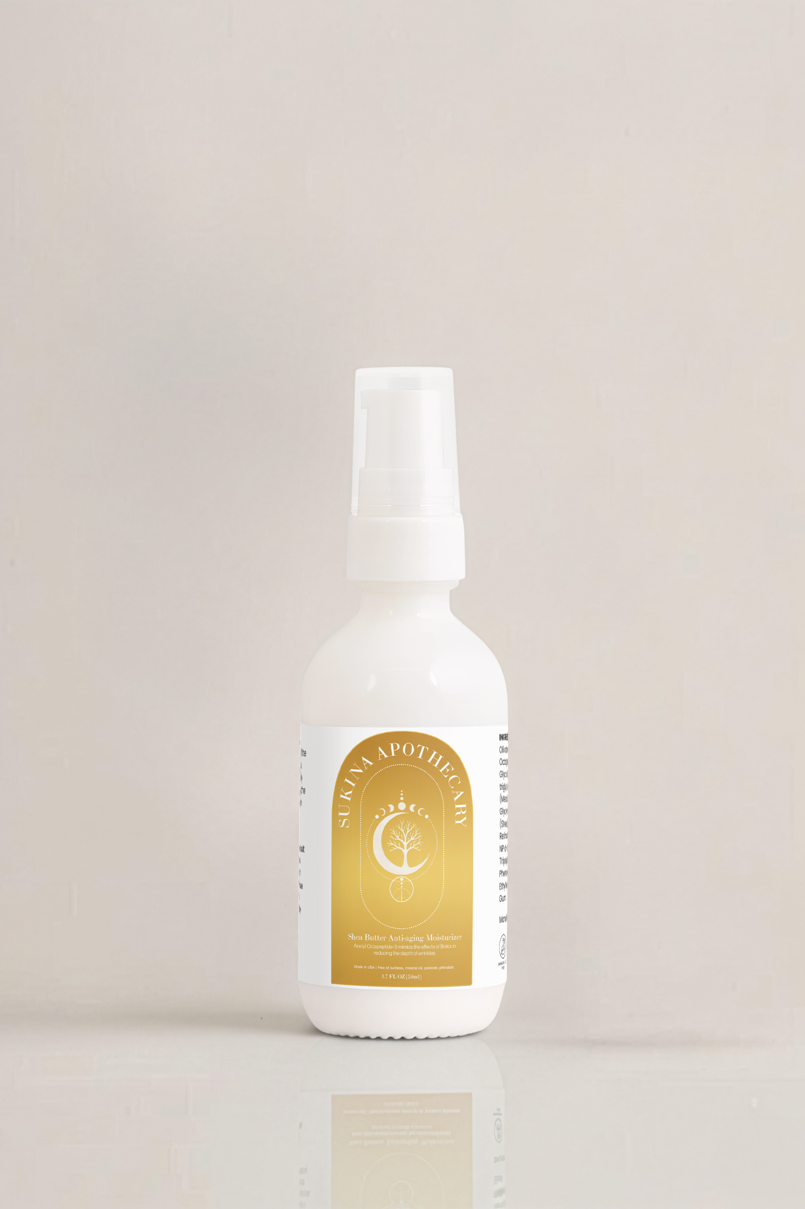 Sukina Apothecary Shea Butter Anti-Aging Moisturizer in white pump bottle with gold label, photographed on a neutral background — enriched with Acetyl Octapeptide-3, Limnanthes, and Shea Butter to smooth wrinkles and deeply hydrate skin.